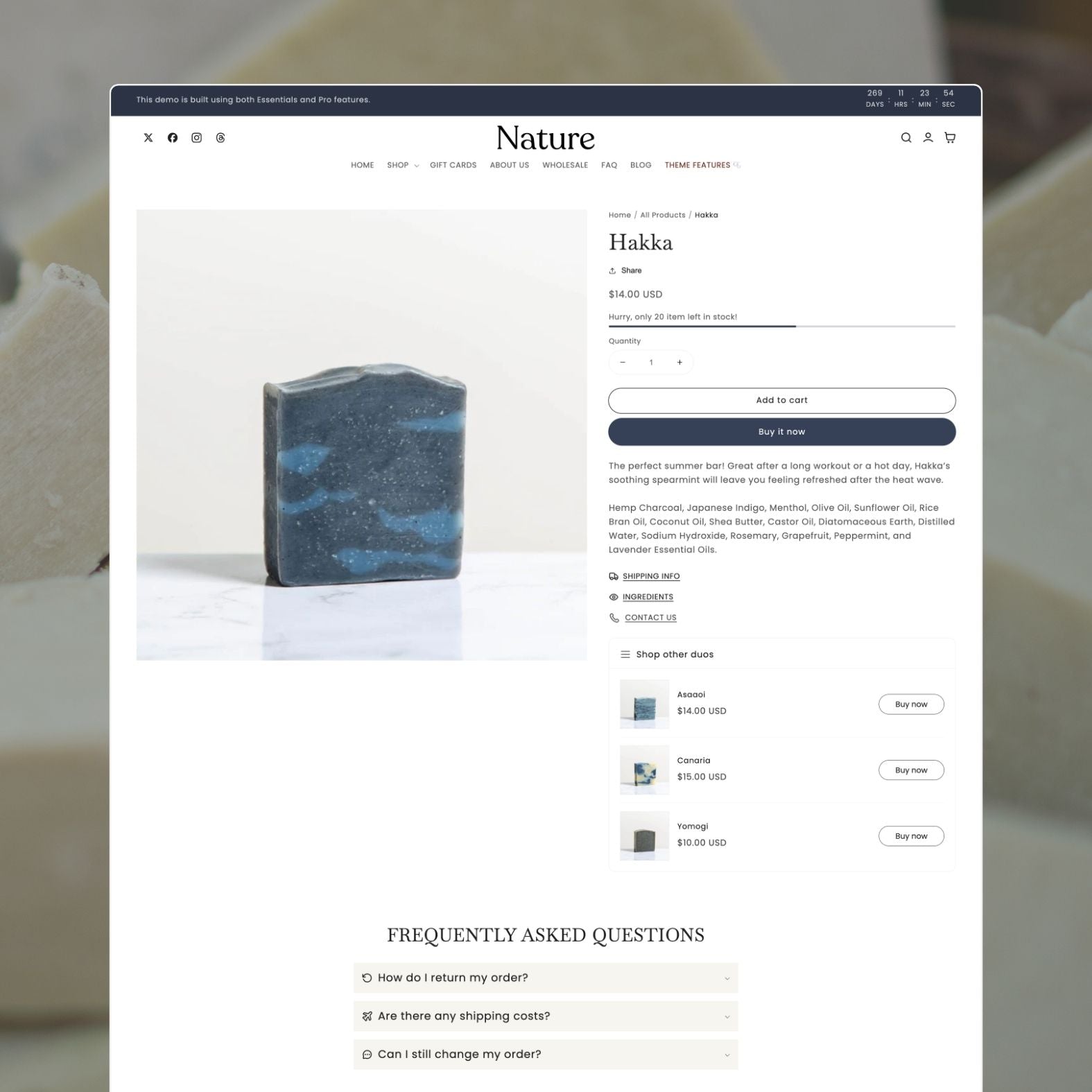 Nature theme product page displaying a Hakka artisan soap bar with blue-toned natural ingredients, detailed description, stock urgency indicator, 'Shop other duos' upsell, and FAQ accordion section