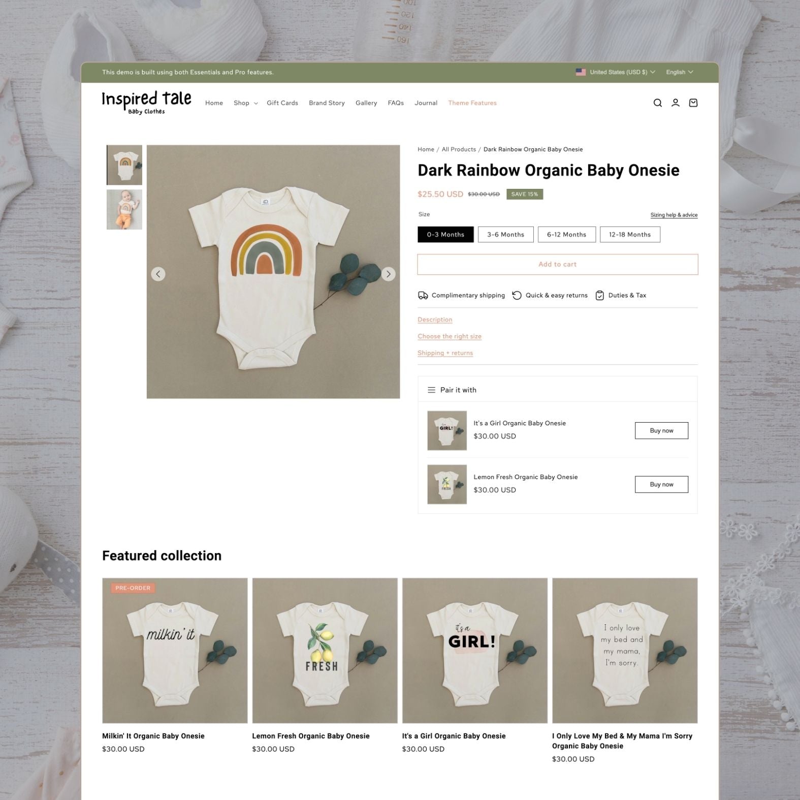 Tale theme product page showing a Dark Rainbow organic baby onesie with size options from 0-3 months to 12-18 months, complimentary shipping badge, 'Pair it with' upsell section, and featured collection of illustrated organic onesies